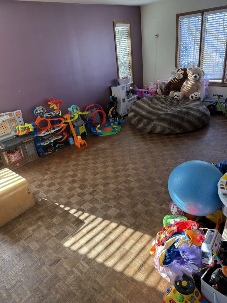 The same playroom with toys put away and the floor clear